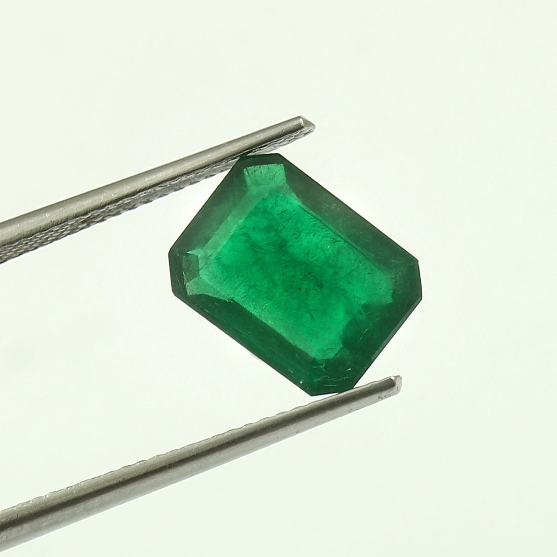 Elegant emerald necklace and ring set symbolizing love, renewal, and emotional healing.